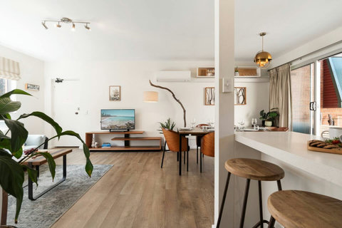 Living & Dining | Light-filled open-plan living flows naturally into the dining area for relaxed stays