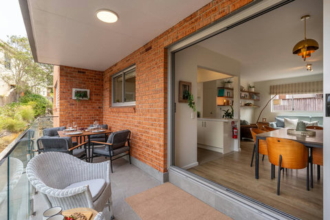 Covered outdoor seating with direct access from the living space, perfect for enjoying Manly’s leafy surrounds