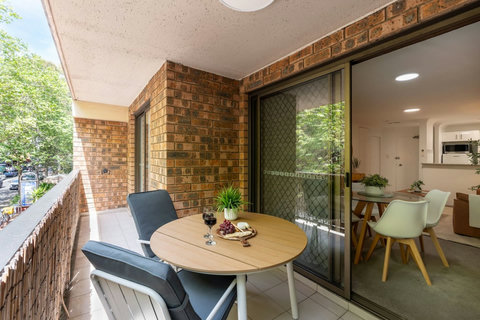 Alfresco dining meets city convenience on this private covered balcony