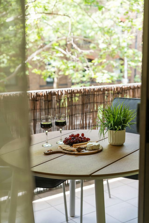 Slow mornings are made for coffee on the balcony with the leafy neighbourhood just beyond