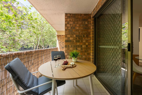 Enjoy a leafy outlook from the balcony, a peaceful spot away from the city buzz