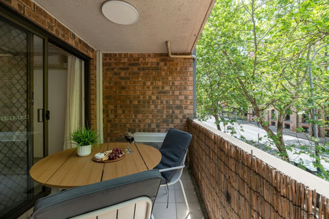 Take a quiet moment outdoors surrounded by greenery on the apartment’s balcony