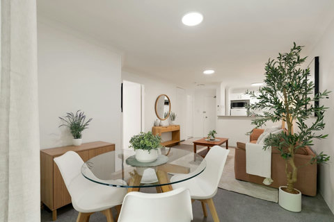 An inviting open-plan dining and living area designed for relaxed stays in the city