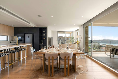 Dining Area | Share meals in the open-plan dining space, with natural light and harbour views creating a lovely backdrop.