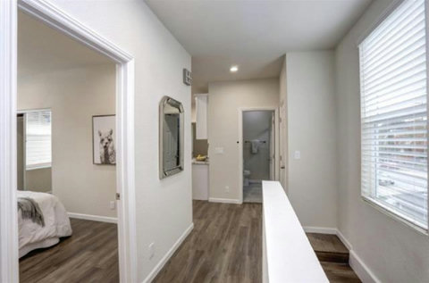 Hallway to shared kitchen and bathroom.