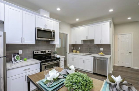 Access to kitchen with stove, dishwasher, microwave, fridge, and cooking essentials.