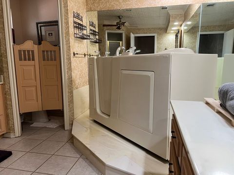 Master bedroom with American Standard Liberation Walk in jetted tub 