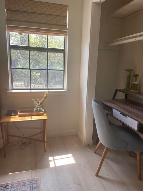 Dedicated workspace with desk and lovely view of backyard.