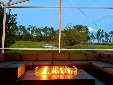 Outdoor Dining - Host exclusive private chef dinners for up to 24 guests outside and 20 inside, complemented by Philip Starck designed chairs. Enjoy scenic views of the private pool, golf course, and unwind by the Fire Pit with a cocktail.