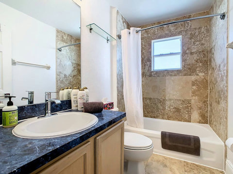 Indulge in this delightful shower and bathtub combo, creating a serene retreat for your relaxation and rejuvenation.
