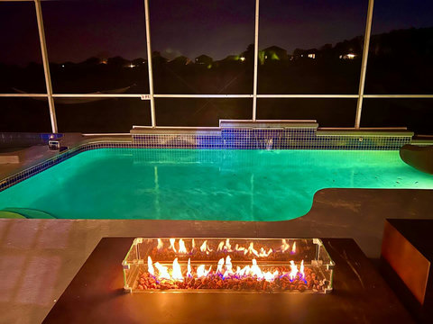 Exclusive Outdoor Oasis - Relax in our private pool with enchanting waterfalls and eclectic lighting. Play basketball with our pool basketball hoop or slide down the water slide. Unwind in the hot tub and enjoy a fine glass of wine by the Fire Pit.
