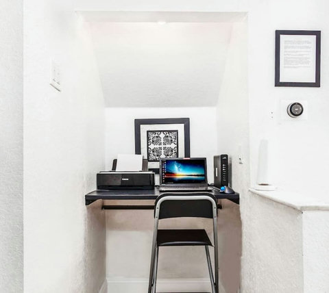 Cozy Workstation with Complimentary WiFi - Stay productive and connected with our laptop-friendly setup.