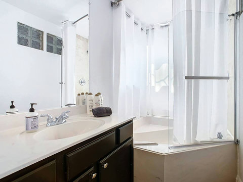 Indulge in the luxury of a Jacuzzi tub and shower combo, creating a spa-like haven for your ultimate comfort.