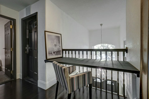 Inspiring Workspace - Catch up on emails or dive into productive work with views overlooking the 20-foot tall entry foyer.