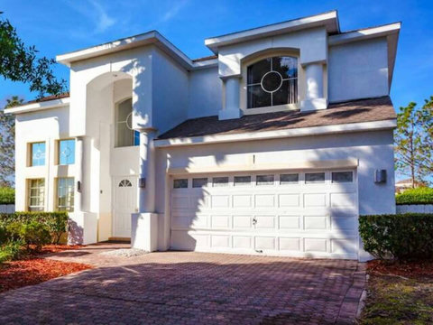 Welcome to DisneyMansion! Enjoy stunning exterior design with beautiful views over your private pool, championship golf course, and resort clubhouse. Access amenities like Lap Pool, Pickleball, Tennis, and Children's Playground.
