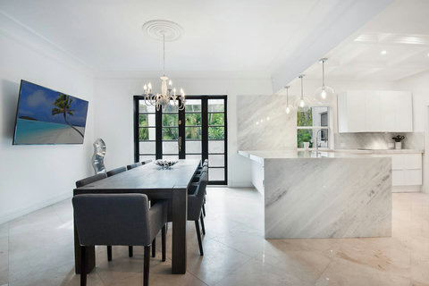 Entertaining Dining room and Brazilian marble waterfall kitchen bar  