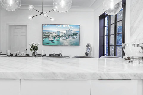Entertaining open floorplan with Entertaining Dining room and Brazilian marble waterfall kitchen bar. Stainless build-in custom appliances with state of induction cooking and wine fridge, soda stream, Nespresso cappuccin maker, two 86-inch SmartTVs. 