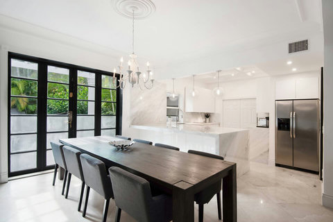 Entertaining Dining room and Brazilian marble waterfall kitchen bar  