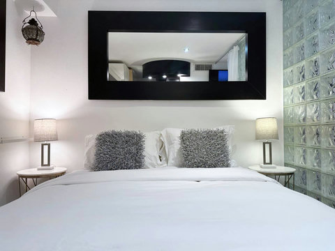 Bedroom with 1 King or 2 Twin Beds and closet. All Bedrooms come with comfortable down comforters and down pillows.