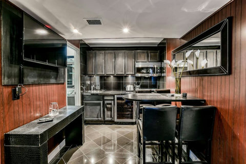 Elegant Master Suite on 2nd Floor: Your private oasis awaits with a bar, kitchen, and cozy lounge area. Experience luxury and comfort like never before!