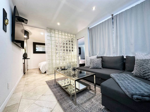 Unwind in our welcoming living room, featuring a comfortable sofa group and a state-of-the-art 50-inch Smart TV