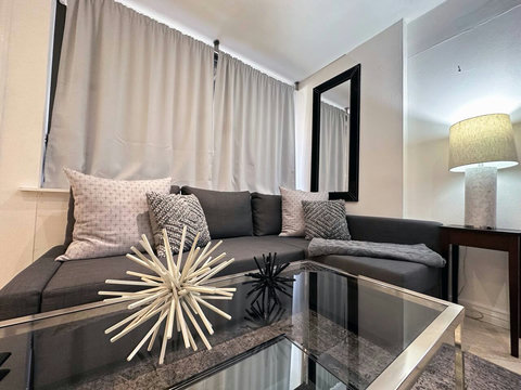 Living Room or Optional 8th bedroom with a sofa bed and a state-of-the-art 50-inch Smart TV.