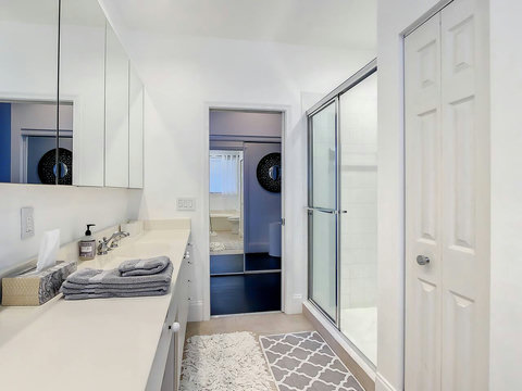 Experience our elegant bathroom, with the luxury of both a bathtub and a serene shower space.