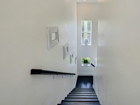 Stay in our chic home, featuring a designer stairway that celebrates creativity and design.