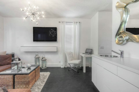 Entertainment delight! Experience our home's living room, equipped with a 50-inch Plasma TV for an endless entertainment options and unforgettable stay.