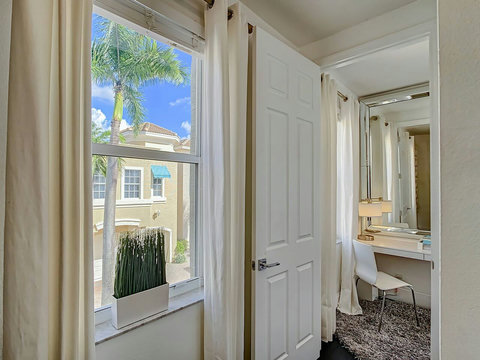 Welcome to tranquility! Our chic home beckons you through this inviting hallway to your serene and cozy bedroom.