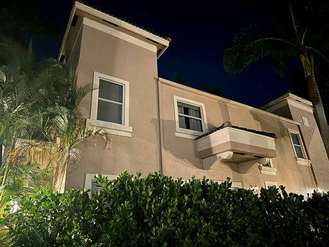 Home exterior at night. 
