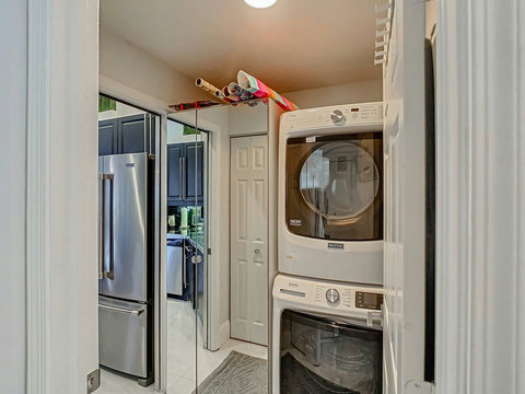 Laundry made luxurious! Our chic home features a top-of-the-line laundry room with Maytag stackable machines for effortless cleaning.