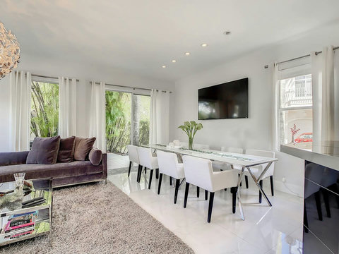 Dine with a view! Experience the charm of our elegant home's dining area, where culinary delights meet stunning patio vistas.