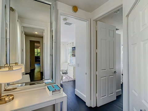 Welcome to tranquility! Our chic home beckons you through this inviting hallway to your serene and cozy bedroom.