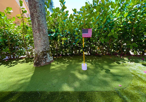 Play and relax! Our chic home offers a putting green right outside the front door, inviting you to golf and unwind. 
