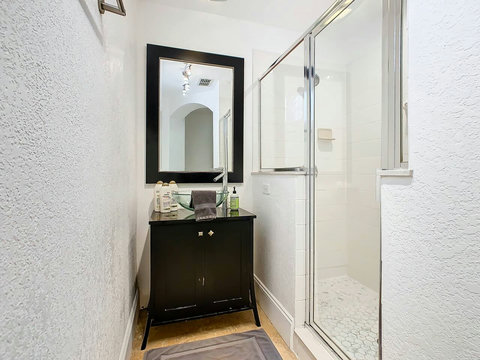Indulge in the luxury of a shower and bathtub combo, creating a serene oasis for your ultimate comfort.