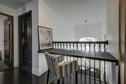 Inspiring Workspace - Catch up on emails or dive into productive work with views overlooking the 20-foot tall entry foyer.
