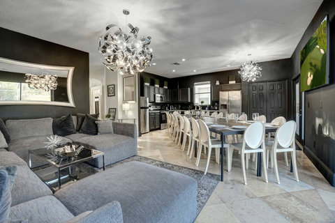 Enjoy our cozy and inviting living room with an open floor plan, perfect for socializing with a connected dining room. Start with cocktails and savor a modern social atmosphere for your family gathering, bachelor/birthday party, or corporate retreat.