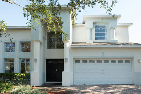 Behold the magnificent exterior of our DisneyEstate! The backyard offers stunning views of your private pool, championship golf course, and resort clubhouse with incredible amenities like Lap Pool, Pickleball, Tennis, and Children's Playground.
