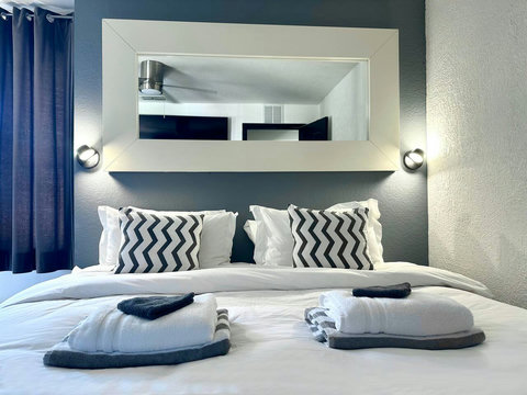 Choose between 1 King Bed or 2 Twin Beds and relax on the cozy daybed for a restful stay.