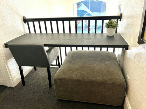 Inspiring Workspace - Catch up on emails or dive into productive work with views overlooking the 20-foot tall entry foyer.
