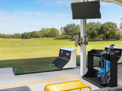 Right outside your private golf villa, you have a World Class Mike Dasher-designed Golf Course and Top-Golf-Tracer Driving Range, Restaurant, Bar, and Pro Shop (generic TopTracer Range photo example).