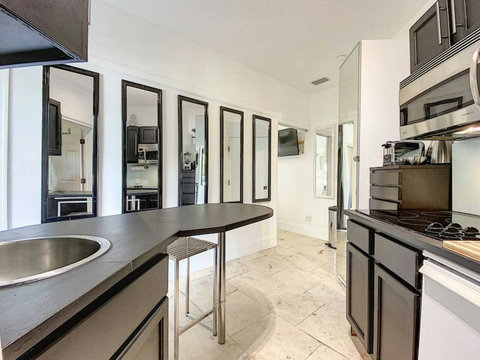 Delight in our fully stocked kitchenette, where you can whip up culinary masterpieces with ease.