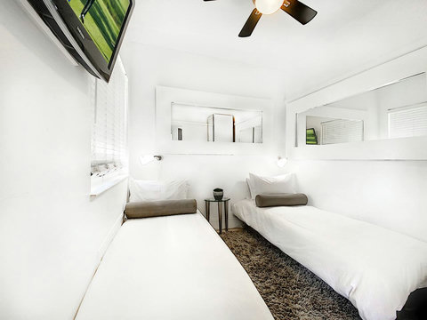 Bedroom Nr 4: with 2 Twin Beds and 24-inch Smart TV and closet.
