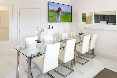 Enjoy the perfect combination of dining and entertainment with a spacious dining area featuring a large Smart TV.
