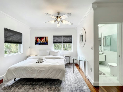 Master Bedroom en-suite with 2 King Size beds and 70 inch smart TVs.