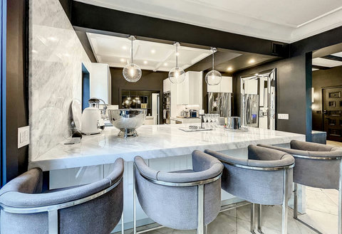 Entertaining Dining room and Brazilian marble waterfall kitchen bar. Stainless build-in custom appliances with state of art induction cooking and wine fridge, soda stream, and Nespresso Cappuccino maker.  