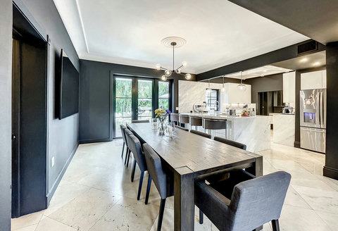 Entertaining Dining room and Brazilian marble waterfall kitchen bar. Stainless build-in custom appliances with state of art induction cooking and wine fridge, soda stream, and Nespresso Cappuccino maker.  