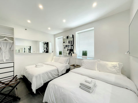 Your ultimate bedroom retreat! Enjoy a 70-inch Smart TV, comfortable memory foam mattresses, cozy dimmer lighting, USB chargers, and Designer Mirrors.
