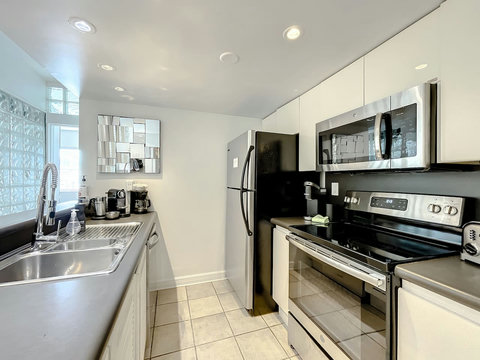 A culinary haven! Discover the second full-size kitchen (2), perfect for a private chef experience. Indulge in gourmet delights.